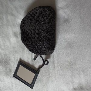 The limited black crochet and bead clutch